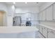 Bright kitchen features white cabinetry, stainless steel appliances and a center island at 3527 101St E Ave, Parrish, FL 34219