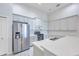 Modern kitchen featuring stainless steel appliances, white countertops, and white cabinets at 3527 101St E Ave, Parrish, FL 34219
