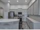 Bright, spacious kitchen with stainless steel appliances and gray cabinets at 3527 101St E Ave, Parrish, FL 34219
