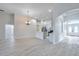 Open-concept living area featuring tile floors and an arched entryway at 3527 101St E Ave, Parrish, FL 34219