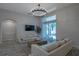 Spacious living room with plush sofas, a large window, and a view to the outdoor patio at 3527 101St E Ave, Parrish, FL 34219
