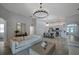 Open-concept living room seamlessly connects the kitchen and dining areas for easy entertaining at 3527 101St E Ave, Parrish, FL 34219