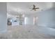 Open-concept living area featuring tile floors and an arched entryway at 3527 101St E Ave, Parrish, FL 34219