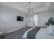 Bedroom featuring a ceiling fan, carpeted floors and en suite at 3527 101St E Ave, Parrish, FL 34219