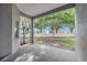 Covered patio area showcasing an outdoor basketball hoop and a view of the backyard at 3527 101St E Ave, Parrish, FL 34219