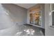 Back patio showcasing neutral colors and views to the home's interior via a large sliding glass door at 3527 101St E Ave, Parrish, FL 34219