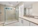 Bright bathroom featuring a glass-enclosed shower with neutral toned tiles and white vanity with chrome faucet at 4210 N Central N Ave, Tampa, FL 33603