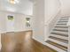 Inviting living space with gleaming hardwood floors and a staircase leading to the upper level at 4210 N Central N Ave, Tampa, FL 33603
