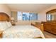 Bedroom with bright light, nice wood finishings and comfortable paisley bedding at 450 Treasure Island Cswy # 505, Treasure Island, FL 33706