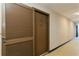 Hallway with a brown door marked 505 that leads to the unit and a shuttered closet at 450 Treasure Island Cswy # 505, Treasure Island, FL 33706
