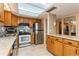 Bright kitchen with stainless steel appliances, granite countertops, and a skylight for natural illumination at 450 Treasure Island Cswy # 505, Treasure Island, FL 33706