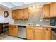 Functional kitchen area featuring stainless steel appliances, granite countertops, and under-cabinet lighting at 450 Treasure Island Cswy # 505, Treasure Island, FL 33706