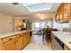 Open living and dining area featuring light tile floors and view of balcony at 450 Treasure Island Cswy # 505, Treasure Island, FL 33706