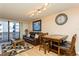 Comfortable living room with plush leather sofa, patterned rug, and sliding glass doors to balcony at 450 Treasure Island Cswy # 505, Treasure Island, FL 33706