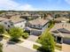 Stunning aerial view of a gray two-story home in a lush community at 4528 Ballantrae Blvd, Land O Lakes, FL 34638