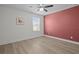 Bedroom featuring laminate flooring, a bright window and a ceiling fan at 4528 Ballantrae Blvd, Land O Lakes, FL 34638