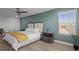 Cozy bedroom with ceiling fan, white linens, and plenty of natural light at 4528 Ballantrae Blvd, Land O Lakes, FL 34638