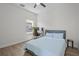 Well-lit bedroom with desk, chair, and comfortable bed at 4528 Ballantrae Blvd, Land O Lakes, FL 34638