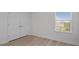 Empty bedroom showing neutral paint, laminate flooring and natural light at 4528 Ballantrae Blvd, Land O Lakes, FL 34638