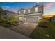 Beautiful two-story home featuring a two-car garage and a manicured front yard with lush landscaping at 4528 Ballantrae Blvd, Land O Lakes, FL 34638
