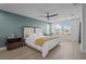 Inviting main bedroom with a fan, soft carpet, light-colored walls, and plenty of natural light from the windows at 4528 Ballantrae Blvd, Land O Lakes, FL 34638