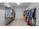 Walk-in closet with built in metal shelving and rod for ample storage at 4528 Ballantrae Blvd, Land O Lakes, FL 34638