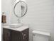 Stylish half bathroom featuring modern fixtures, shiplap walls, and a vessel sink at 5009 W Longfellow Ave, Tampa, FL 33629