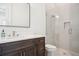 Modern bathroom with glass-enclosed shower, sleek vanity, and stylish fixtures at 5009 W Longfellow Ave, Tampa, FL 33629