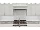 A modern kitchen with stainless steel appliances and a stylish tile backsplash at 5009 W Longfellow Ave, Tampa, FL 33629