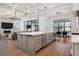 This open-concept kitchen features a large island and seamless flow into the living space at 5009 W Longfellow Ave, Tampa, FL 33629
