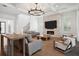 Spacious living room with hardwood floors, a fireplace, and stylish furniture at 5009 W Longfellow Ave, Tampa, FL 33629