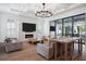 Bright living room with large windows, a fireplace, and modern decor at 5009 W Longfellow Ave, Tampa, FL 33629