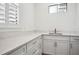 Bright mud room with white cabinets, counter space, and natural light, offering a practical and organized entry space at 5009 W Longfellow Ave, Tampa, FL 33629