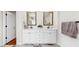 Bathroom featuring a double sink vanity with marble countertop, modern faucets and hardware at 501 Sportsman Park Dr, Seffner, FL 33584