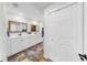 This bright bathroom features a double sink, closet, and luxury finishes at 501 Sportsman Park Dr, Seffner, FL 33584
