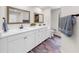 Light and airy bathroom with double sinks, modern fixtures, and elegant finishes at 501 Sportsman Park Dr, Seffner, FL 33584