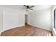 Bright bedroom with hardwood floors, ceiling fan, and a closet at 501 Sportsman Park Dr, Seffner, FL 33584