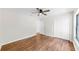This bright bedroom boasts sleek hardwood floors and a ceiling fan at 501 Sportsman Park Dr, Seffner, FL 33584