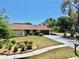 Beautiful home featuring a verdant front lawn, mature trees, and a long driveway at 501 Sportsman Park Dr, Seffner, FL 33584