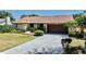 Lovely one-story home with well-maintained landscaping, driveway, and a neutral-colored exterior at 501 Sportsman Park Dr, Seffner, FL 33584
