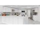 Modern kitchen with white cabinets, marble countertops and floors, and stainless appliances at 501 Sportsman Park Dr, Seffner, FL 33584