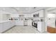Bright, updated kitchen featuring white cabinets, stainless appliances, and tile backsplash at 501 Sportsman Park Dr, Seffner, FL 33584