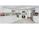 Modern kitchen featuring white cabinets, stainless steel appliances, and marble countertops at 501 Sportsman Park Dr, Seffner, FL 33584