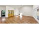 Large living room featuring wood floors, light walls, and bright windows at 501 Sportsman Park Dr, Seffner, FL 33584