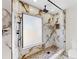 Modern shower with marble walls, pebble floor, rainfall showerhead and frameless glass enclosure at 501 Sportsman Park Dr, Seffner, FL 33584