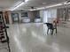 Large open hall with polished floors, table arrangements, and neutral decor ideal for gatherings and events at 5330 77Th N St, St Petersburg, FL 33709