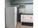 Kitchen with white cabinetry, a full-size refrigerator, and a practical layout for efficient cooking at 5330 77Th N St, St Petersburg, FL 33709
