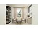 Dining room features a table with six chairs and a black shelving unit at 5743 Yellow Hornbill Ave, Wimauma, FL 33598