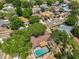 A charming aerial view reveals a beautiful home with a screened-in pool at 601 Cedar Grove Dr, Brandon, FL 33511