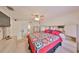 Bright bedroom featuring a large bed, ceiling fan, and ample closet space at 601 Cedar Grove Dr, Brandon, FL 33511